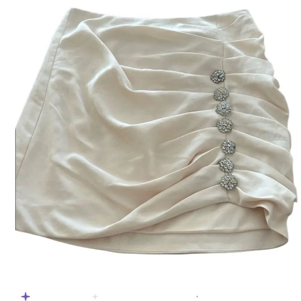 DO+BE Cream Mini Skirt- rhinestone button Embellishments small new without tags
